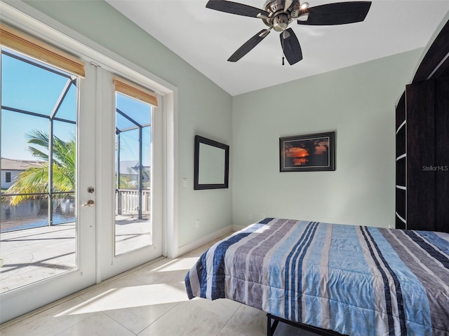 9567 Honeymoon Dr, Port Charlotte, FL 33981 - bedroom featuring access to outside, tile patterned flooring, a ceiling fan, and a water view