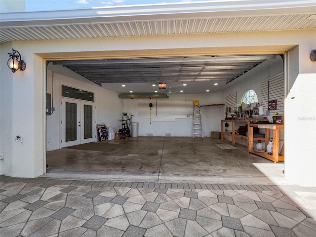 garage featuring french doors and a garage door opener