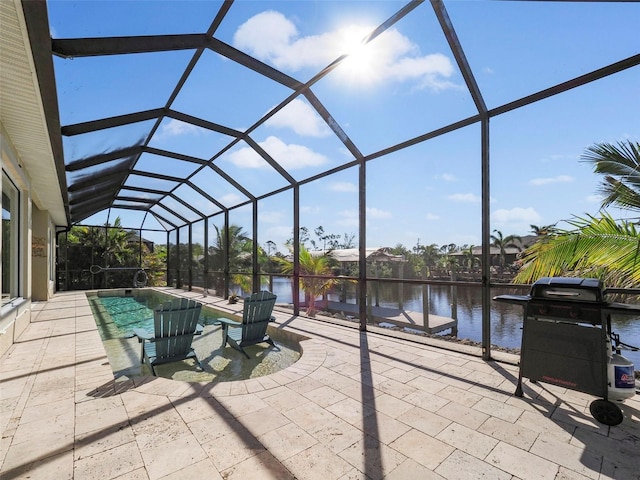 9567 Honeymoon Dr, Port Charlotte, FL 33981 - view of patio featuring grilling area, an outdoor pool, a water view, and glass enclosure