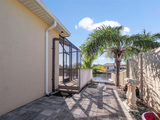 9567 Honeymoon Dr, Port Charlotte, FL 33981 - view of patio featuring a lanai and a water view
