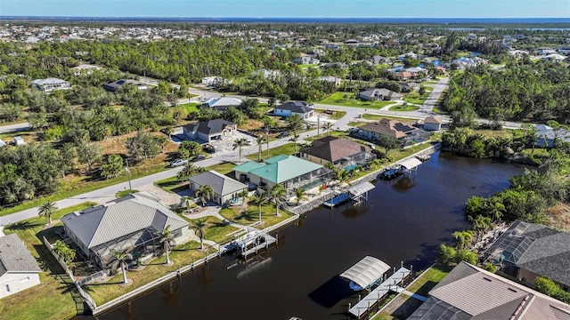 9567 Honeymoon Dr, Port Charlotte, FL 33981 - aerial perspective of suburban area with a large body of water