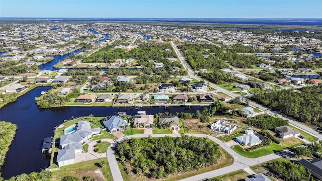 9567 Honeymoon Dr, Port Charlotte, FL 33981 - aerial overview of property's location with nearby suburban area and a large body of water