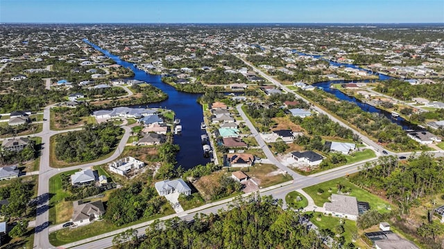 9567 Honeymoon Dr, Port Charlotte, FL 33981 - view of property location featuring a nearby body of water and nearby suburban area