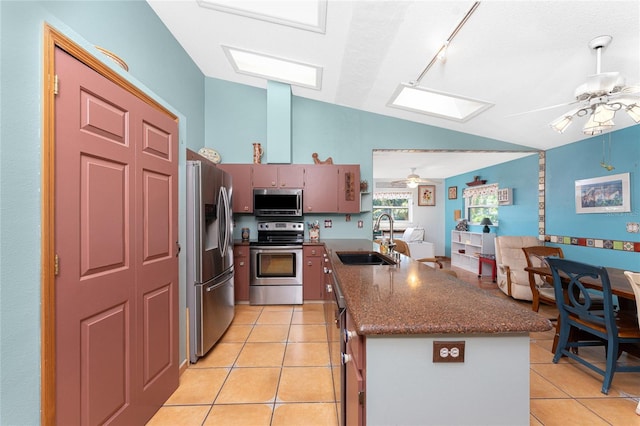 kitchen with ceiling fan, light tile patterned floors, sink, and appliances with stainless steel finishes