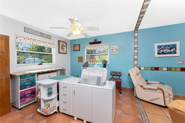 interior space featuring tile patterned floors and ceiling fan