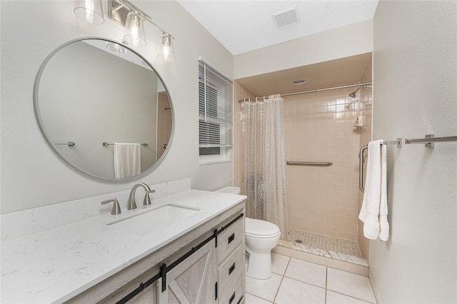 bathroom featuring vanity, tile patterned flooring, toilet, a textured ceiling, and curtained shower