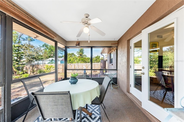 sunroom / solarium with ceiling fan