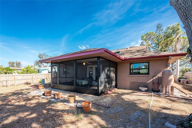 back of property featuring a sunroom