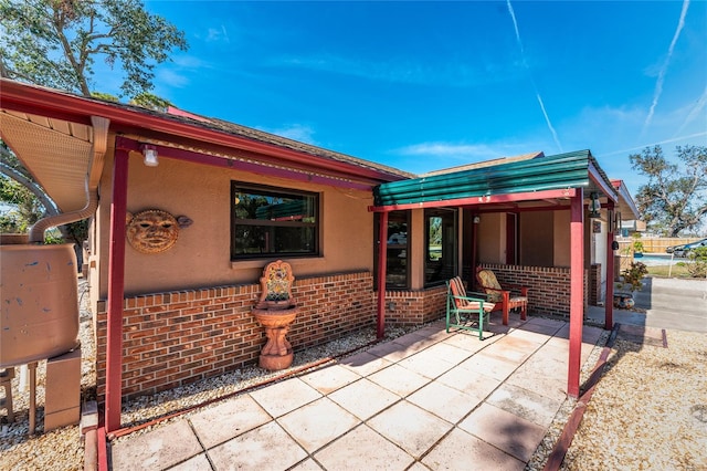 rear view of house with a patio