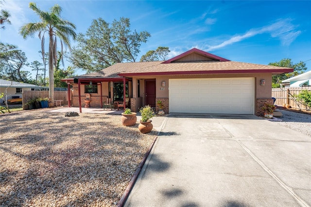 ranch-style home featuring a garage