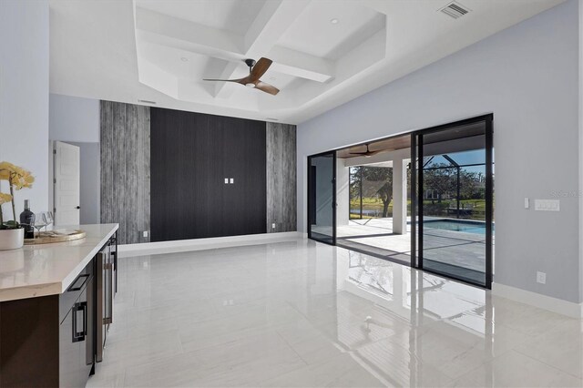 living room featuring beamed ceiling, ceiling fan, and coffered ceiling