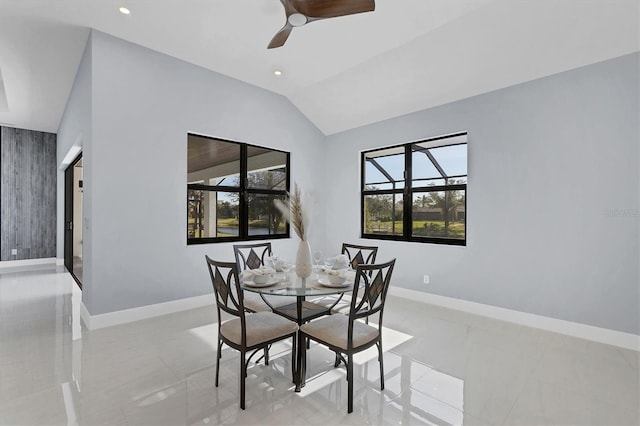 dining room with ceiling fan and lofted ceiling