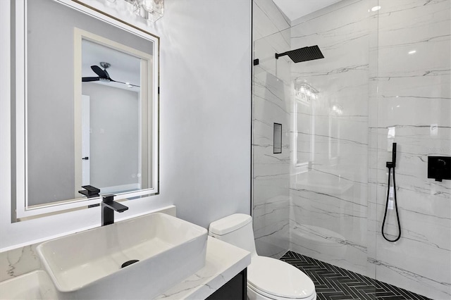 bathroom featuring vanity, an enclosed shower, and toilet