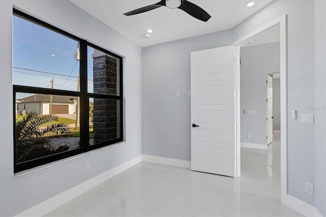 spare room with ceiling fan