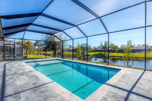 view of pool featuring a patio, a water view, and a lanai