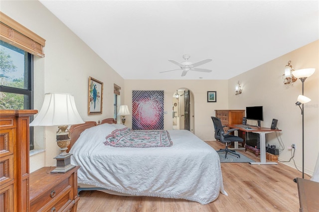 bedroom with light hardwood / wood-style flooring and ceiling fan