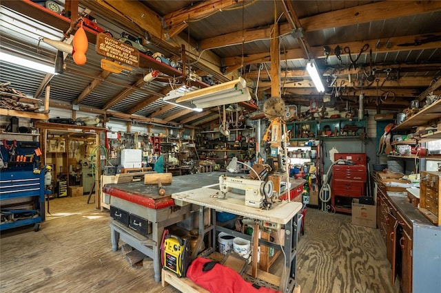 interior space with a workshop area and lofted ceiling