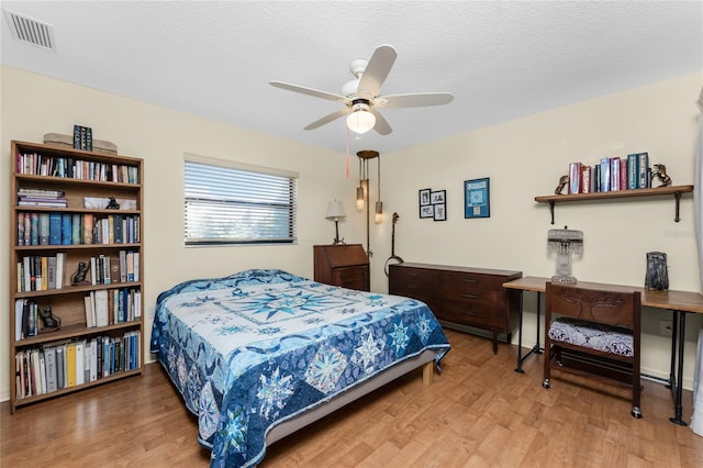 bedroom featuring hardwood / wood-style floors and ceiling fan