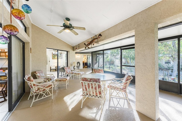 sunroom featuring ceiling fan and vaulted ceiling