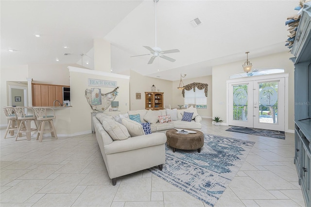 tiled living room featuring french doors, high vaulted ceiling, and ceiling fan