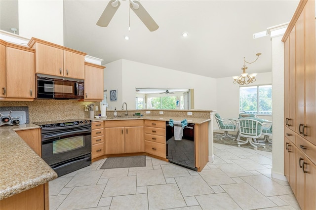 kitchen with kitchen peninsula, light brown cabinetry, plenty of natural light, and black appliances