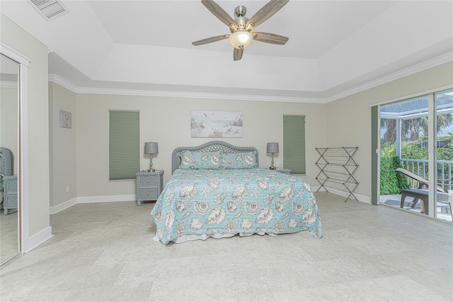 carpeted bedroom with ceiling fan, ornamental molding, access to outside, and a tray ceiling