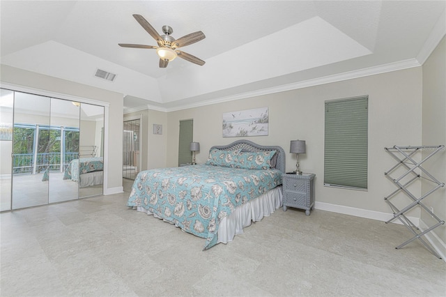 bedroom featuring ceiling fan, crown molding, access to outside, and a tray ceiling