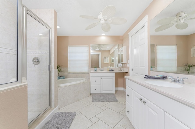 bathroom with tile patterned flooring, vanity, ceiling fan, and shower with separate bathtub