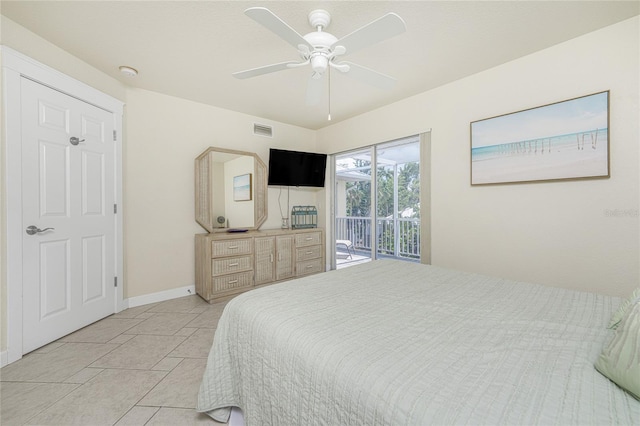 bedroom with ceiling fan, light tile patterned floors, and access to outside