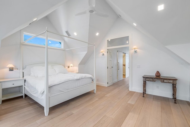 bedroom featuring ceiling fan, light hardwood / wood-style floors, and high vaulted ceiling