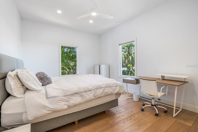 bedroom with wood-type flooring and ceiling fan