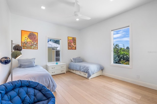 bedroom featuring light hardwood / wood-style flooring and ceiling fan