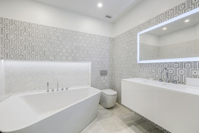 bathroom featuring toilet and a bathing tub