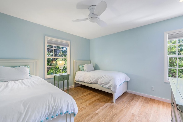 bedroom featuring light wood-type flooring and ceiling fan