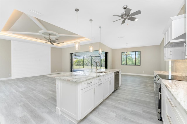 kitchen with white cabinets, appliances with stainless steel finishes, and plenty of natural light