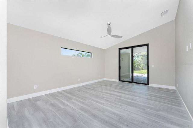 unfurnished room with ceiling fan, light hardwood / wood-style floors, lofted ceiling, and a wealth of natural light