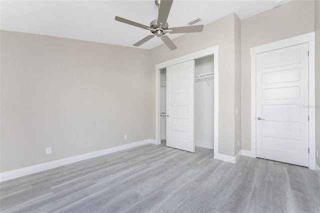 unfurnished bedroom featuring ceiling fan, a closet, and light hardwood / wood-style flooring