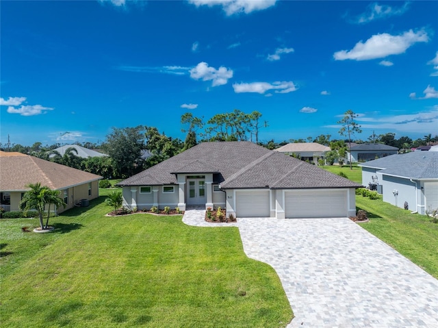 ranch-style home featuring a garage and a front lawn