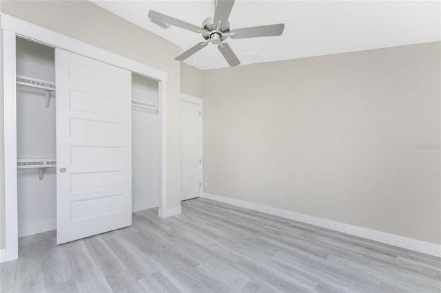 unfurnished bedroom with ceiling fan and light wood-type flooring