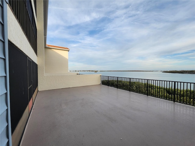 view of patio with a water view