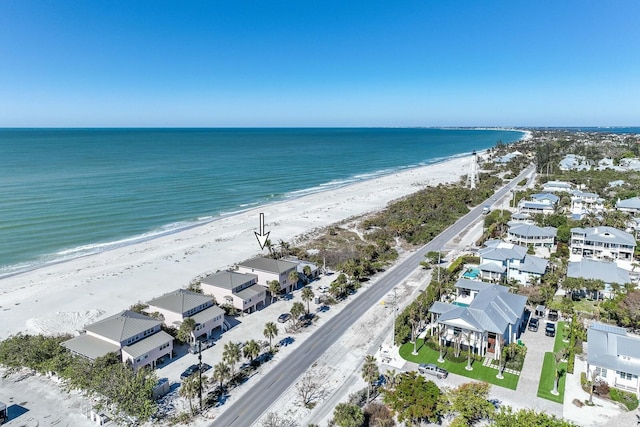 aerial view featuring a water view and a view of the beach