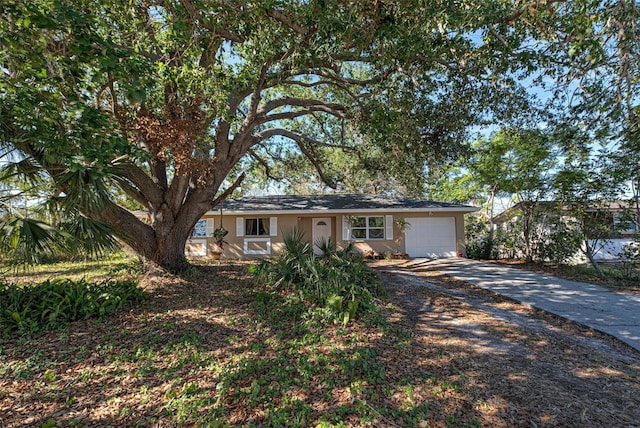 ranch-style house featuring a garage