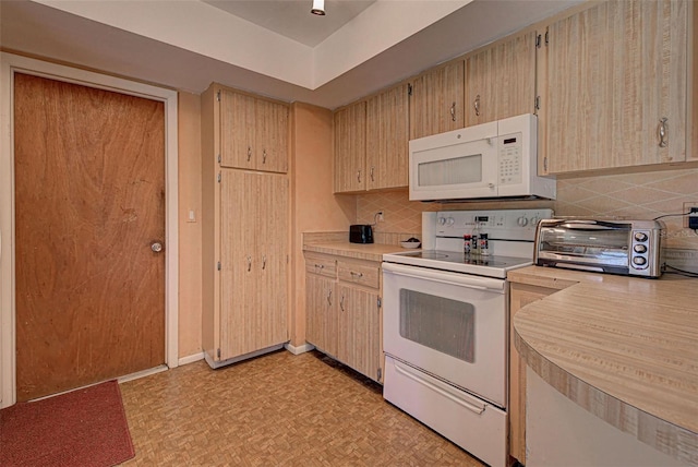 kitchen featuring light brown cabinetry, white appliances, and backsplash