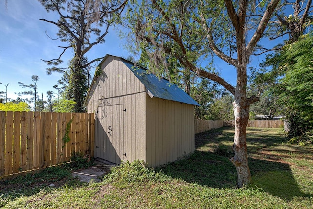 view of outdoor structure featuring a lawn