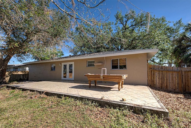 rear view of house featuring french doors and a patio