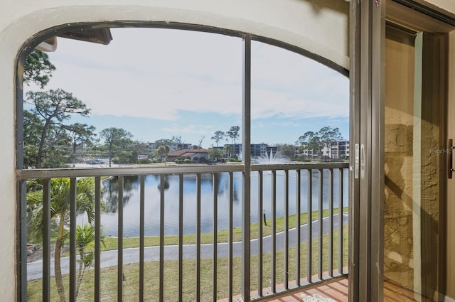 balcony featuring a water view