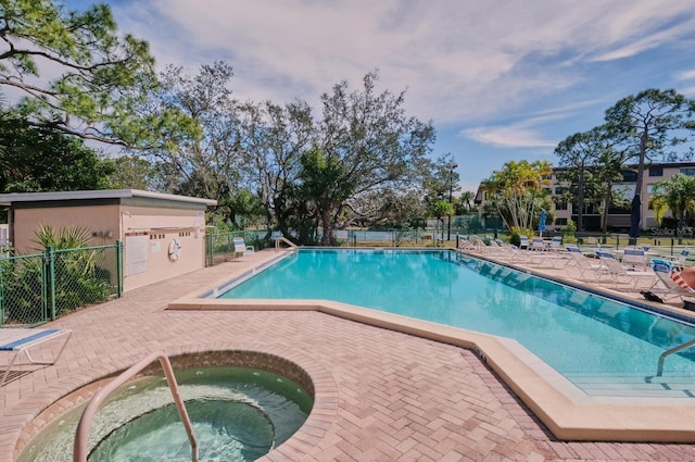 view of pool featuring a community hot tub