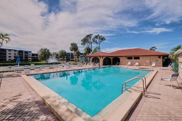 view of swimming pool with a patio area