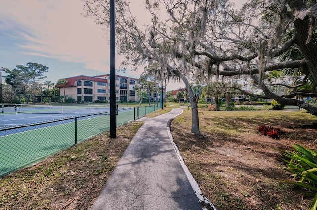 surrounding community with tennis court