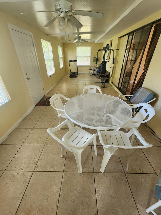 tiled dining area with ceiling fan